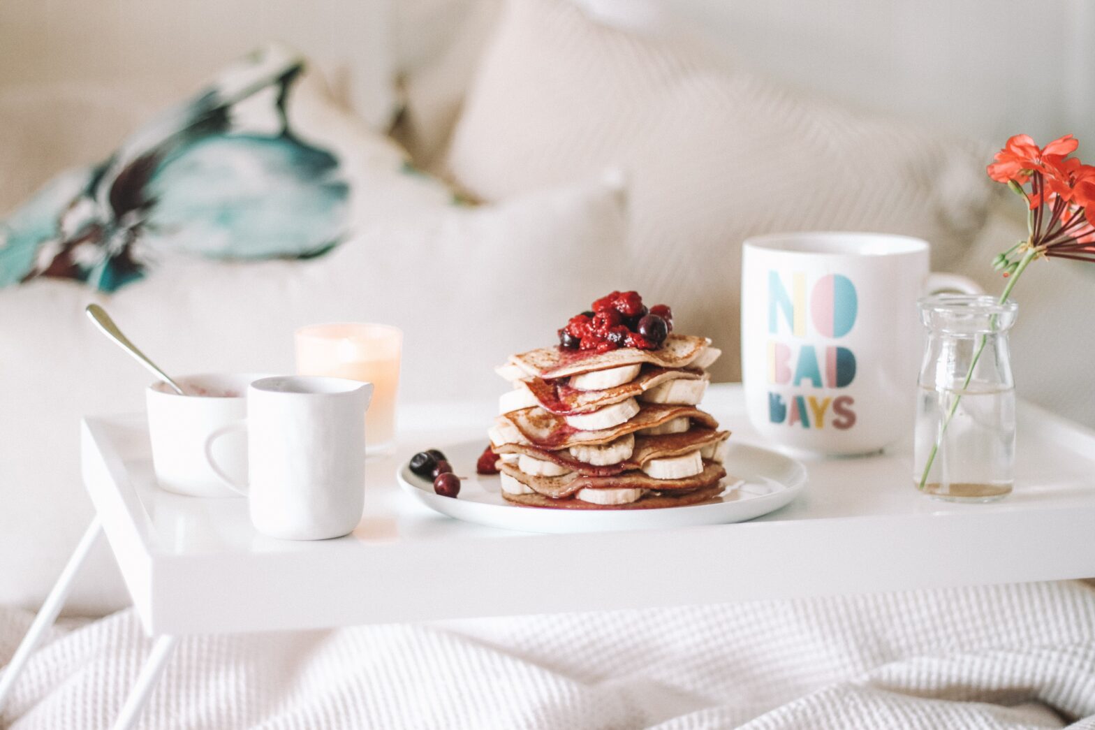 Breakfast in bed with home made pancakes, maple syrup and a huge cup of coffee.