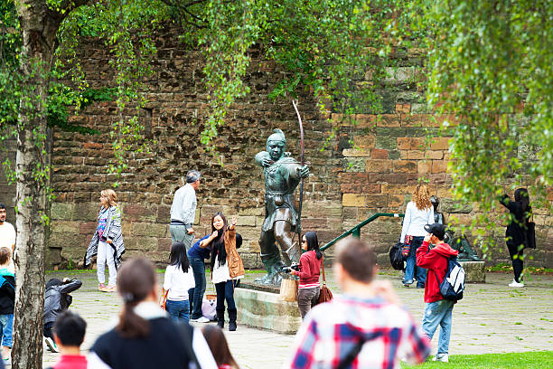 Capure of tourists from many countries around statue of Robin Hood in Nottingham.